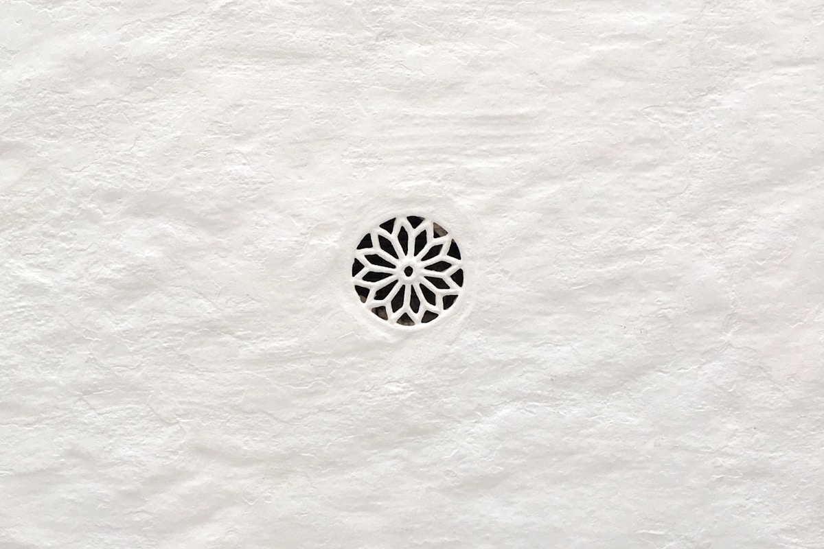 Geometric pattern carved into white paper